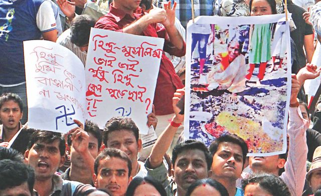 People of the Hindu community demonstrate in front of Chittagong Press Club yesterday against the recent vandalism and torching of Hindu homes and temples across the country. They vowed to resist such attacks in future. Photo: Star