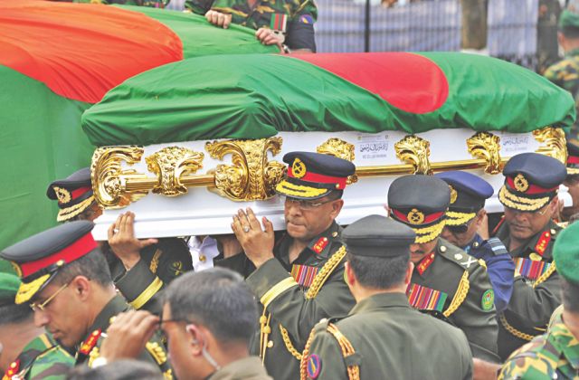 senior army officials earlier carry the coffin of late president to the venue. Photo: Firoz Ahmed