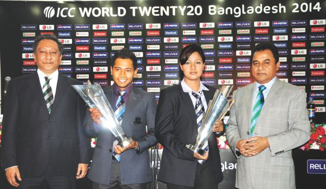 THE COUNTDOWN BEGINS: Bangladesh captain Mushfiqur Rahim (2nd from L) and Bangladesh women's team's former vice-captain Sathira Zakir Jesy (2nd from R) hold the ICC World T20 trophies at the BCB headquarters in Mirpur yesterday, exactly a year before the finals of the glitzy tournament which will be played across Bangladesh from March 16 to April 6 next year. Also seen in the picture are ICC vice-president AHM Mustafa Kamal (R) and BCB president Nazmul Hasan Papon. Photo: Star