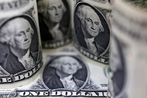 Dollar edges higher as traders await US inflation report