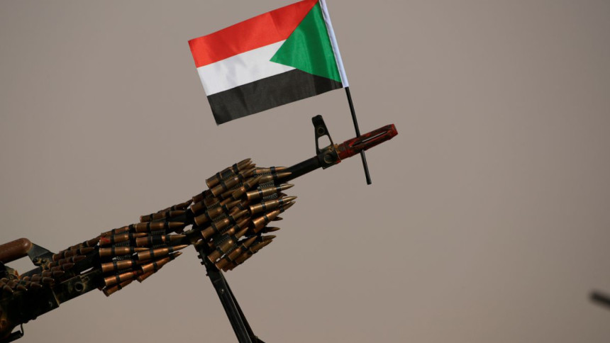 sudan-flag-gun-reuters sudan-flag-gun-reuters
