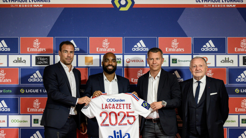 French forward Alexandre Lacazette poses with the team jersey next to Olympique Lyonnais (OL) French president Jean Michel Aulas (2ndR), recruiting director Bruno Cheyrou (L) and Deputy General Director Vincent Ponsot (R) during a press conference to anno French forward Alexandre Lacazette poses with the team jersey next to Olympique Lyonnais (OL) French president Jean Michel Aulas (2ndR), recruiting director Bruno Cheyrou (L) and Deputy General Director Vincent Ponsot (R) during a press conference to anno