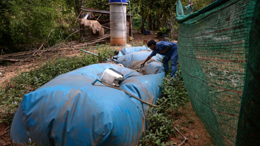 A balloon is used to store wastes materials for powergeneration Thai village,using poop,generate power,renewable energy,green technology,environment friendly,energy crusaders,afp