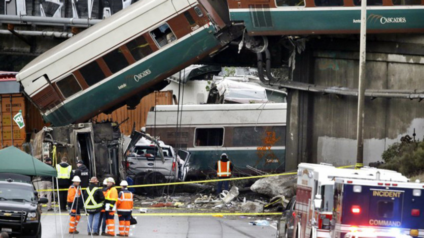 Cars from an Amtrak train lay spilled Cars from an Amtrak train lay spilled