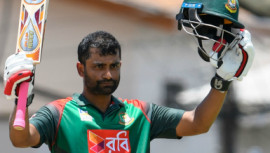 Tamim Iqbal celebrates his century during the 3rd and final ODI match between West Indies and Bangladesh