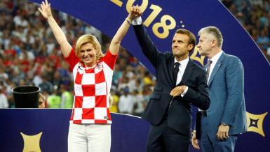 Soaked but smiling, Croatian president wins admirers at WC final