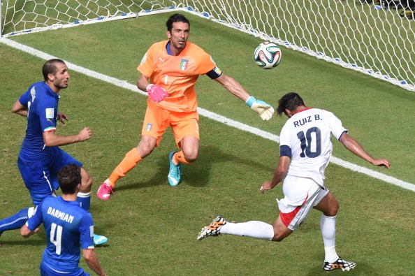 Costa Rica's forward Bryan Ruiz (R) heads the ball to score as Italy's goalkeeper Gianluigi Buffon (2nd R) looks on during a Group D football match between Italy and Costa Rica at the Pernambuco Arena in Recife during the 2014 FIFA #WorldCup on June 20, 2014. Photo: Getty Images Photo: Getty Images