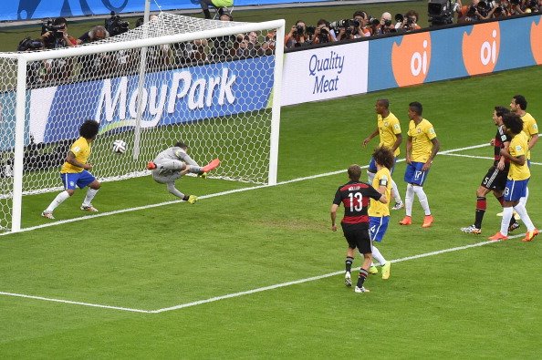 Germany's forward Thomas Mueller (3L) scores during the semi-final football match between Brazil and Germany at The Mineirao Stadium in Belo Horizonte during the 2014 FIFA World Cup on July 8, 2014. Photo: Getty Images