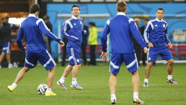 Lionel Messi (C) warms up during a training session at Arena Corinthians on July 08, 2014 in Sao Paulo, Brazil. Argentina will face The Netherlands as part of a 2014 FIFA World Cup Brazil Semi Final match on July 09. Photo: Getty Images