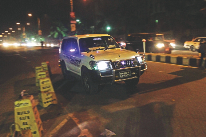 A car driver takes the wrong side of the street in front of Ruposhi Bangla Hotel in the capital yesterday evening, even after the High Court's directive on the government to ensure that such practices be stopped.  photo: SK Enamul Haq