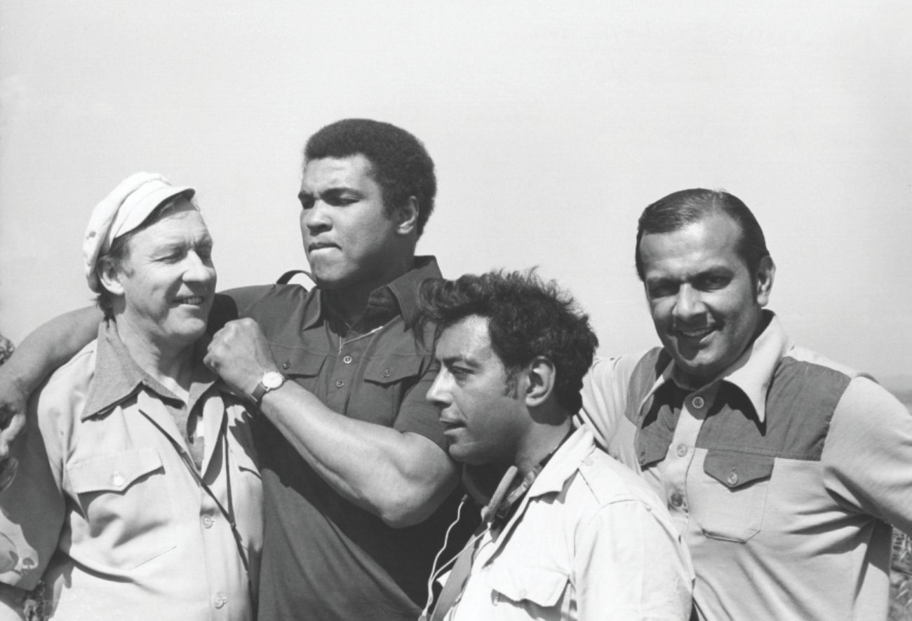 During a break from filming, Ali threatens chief cameraman Rory MacLeod. On the right is Reginald Massey, and in front is chief sound recordist Eric Chohan.  PHOTOS: STAR/REGINALD MASSEY