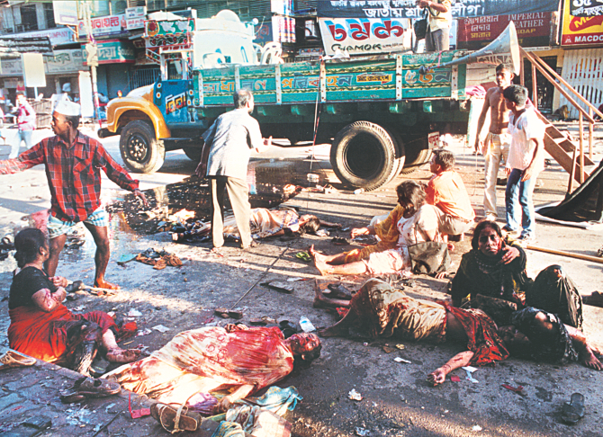 After the hail of grenades on an Awami League rally on Bangabandhu Avenue a few rush to help as the injured regain consciousness surrounded by bodies on this day 10 years ago. Photo: File