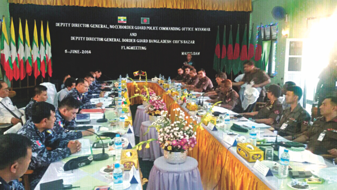 Officials of Border Guard Bangladesh, in the right row, and Myanmar's Border Guard Police (BGP) at a deputy director general-level (DDG) flag meeting in Myanmar's Maungdaw yesterday, as tension flared on the border after a BGB nayek, Mizanur Rahman, was shot dead by BGP in an unprovoked attack on May 28. The two sides were led by Cox's Bazar Sector Commander Col Khandker Farid Hasan and Maungdaw's Director Police Brig Thin Ko Ko. Photo: BGB