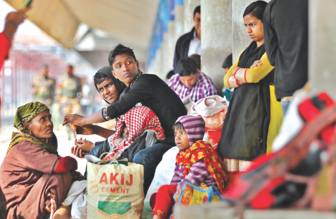 Stranded passengers at Chittagong Railway Station after rail tracks were removed in Nangalkot upazila, Comilla. Photo: Star, Banglar Chokh