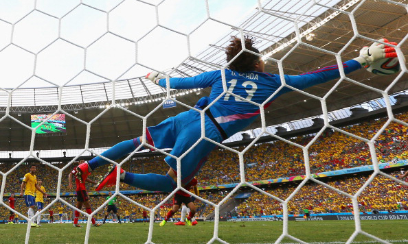 Mexico's goalkeeper Guillermo Ochoa dives for the ball during a Group A football match between Brazil and Mexico in the Castelao Stadium in Fortaleza during the 2014 FIFA World Cup. Photo: AFP/Getty Images