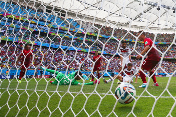 Thomas Mueller of Germany scores his team's fourth goal and completes his hat trick past Rui Patricio of Portugal during the 2014 FIFA World Cup Brazil Group G match between Germany and Portugal at Arena Fonte Nova in Salvador, Brazil. Photo: Getty Images