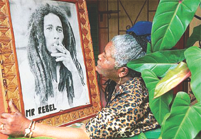 Cedella Booker with the protrait of her late son.