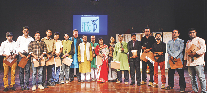 Winners at the gala award ceremony of the film, photography, and lyrics competition Celebrating Life Contest 2014, with the chief guest, Cultural Affairs Minister Asaudzzaman Noor, and Standard Chartered Bank  Chief Executive Officer Jim McCabe in Osmani Memorial Auditorium of the capital yesterday. The contest is a Standard Chartered Bank-The Daily Star initiative . The theme of the seventh year was ‘Living in Harmony’ Photo: Rashed Shumon And Amran Hossain