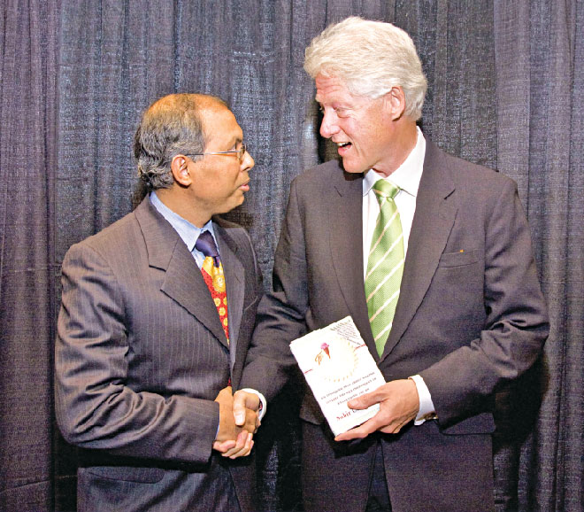Presenting his book ‘The Ice Cream Maker’ to US President Clinton.