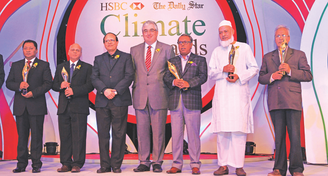 From left … Selim H Rahman, chairman and managing director of Hatil Complex Ltd, Prem Soni, finance director of Cosmopolitan Industries Pvt Ltd, Atiur Rahman, governor of Bangladesh Bank, Andrew Tilke, chief executive officer of HSBC Bangladesh, Shykh Seraj, farmers' rights activist, Dalil Uddin Ahmed, chairman of Chittagong Waste Treatment Plants Ltd, and Moral Noor Mohammad, executive director of RUSTIC, at the award-giving ceremony of HSBC-The Daily Star Climate Awards 2013 held at Ruposhi Bangla Hotel in Dhaka last night.  Photo: Star