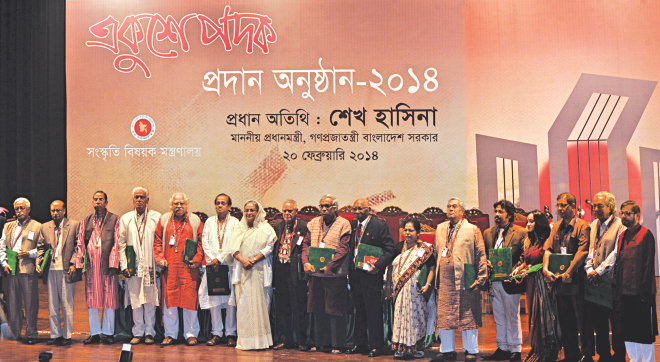Recipients of the coveted Ekushey Padak pose with Prime Minister Sheikh Hasina at the Osmani Memorial Auditorium in the capital yesterday.  Photo: BSS