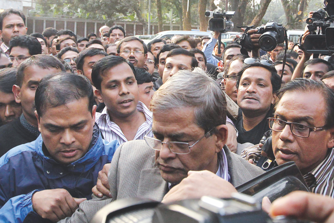 BNP's acting secretary general Mirza Fakhrul Islam Alamgir being escorted out of the Jatiya Press Club premises by law enforcers yesterday. Photo: Amran Hossain
