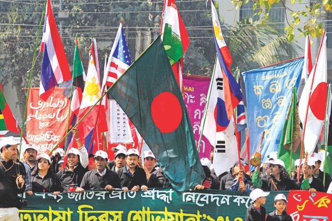 Bangladesh Sangskritik Karmi Sangha brings out a procession from the Dhaka University's TSC area yesterday to show respect to all the mother tongues marking International Mother Language Day today. Photo: Palash Khan
