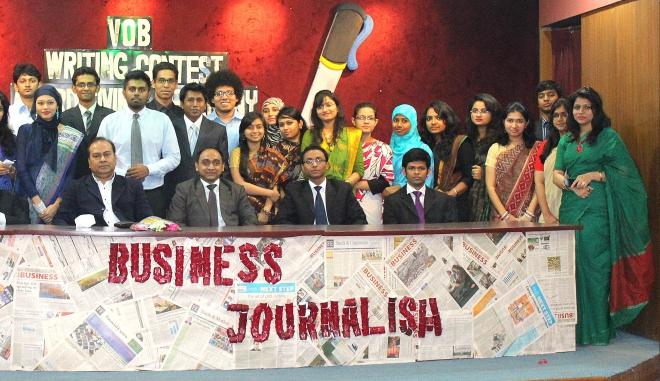 Shibli Rubayat-Ul-Islam, dean of business studies faculty of Dhaka University, poses with the participants in a business journalism workshop, on the university campus in the capital on Sunday. Voice of Business, a business magazine, organised the event. Photo: Faculty of business studies