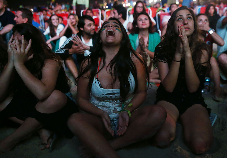 Brazil fans react on Copacabana Beach on July 12, 2014 in Rio de Janeiro, Brazil as the Netherlands beat Brazil 3-0 in the 2014 FIFA World Cup third place match. Photo: Getty Images