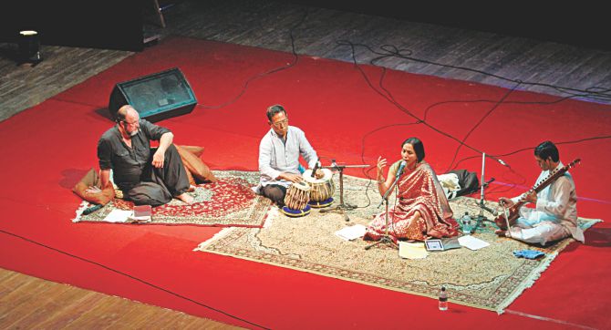 William Dalrymple (L) leans on cushion pillows on the carpet, as Vidya Shah (2-R), with the table and esraj, brings the Mughal atmosphere to Hay. Photo: Ridwan Adid Rupon