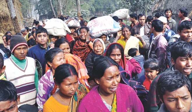 Hindus and Awami Leaguers of Chehelgazi union in Dinajpur, attempt to leave the area following attacks on their homes, businesses and properties. Photo: Star/ Focus Bangla