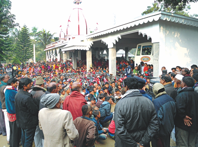 Hundreds of local Hindus take refuge at a temple in Goreya upazila since Sunday night in fear of attacks by Jamaat-BNP men.  Photo: Star/ Focus Bangla