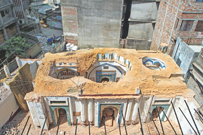 The 324-year-old Hinga Bibi Masjid on KP Ghosh Road in Armanitola in the capital passed the test of time but had to yield to the insensitivity of the owners of the property who were tearing it down to build a multi-storied mosque.   Photo: Palash Khan