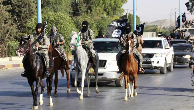 Militants of Islamic State (IS) parade at somewhere in Syria. Photo: cfr.org