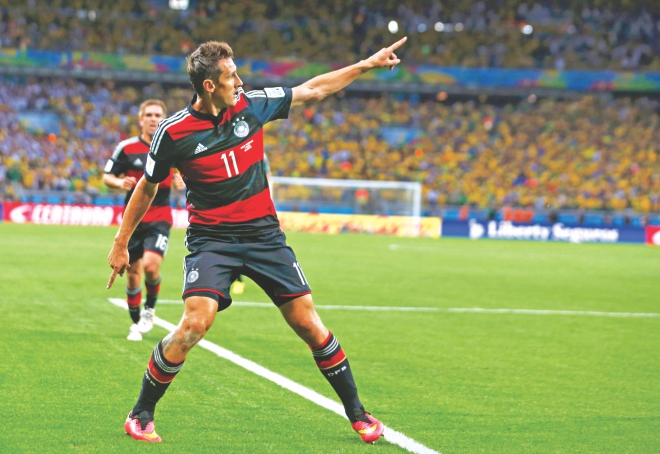 World Cup's number one ... Germany's Miroslav Klose celebrates after striking his World Cup record-setting 16th goal, and his side's second, in a record 7-1 win over Brazil in the first semifinal at the Estadio Mineirao in Belo Horizonte on Tuesday. PHOTO: REUTERS