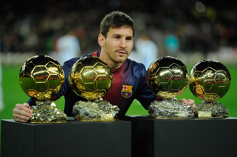 Leo Messi of Barcelona FC displays his four ballons d'or to the audience prior to the Copa del Rey Quarter Final match between Barcelona FC and Malaga CF at Camp Nou on January 16, 2013 in Barcelona, Spain. Photo: Getty Images