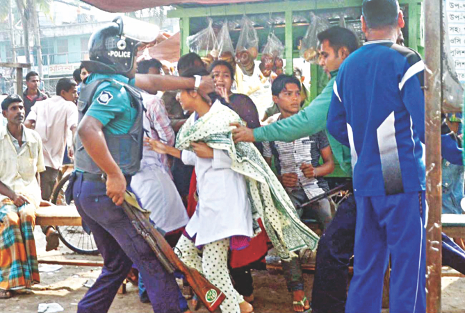 Police action on a demonstration by Diploma Medical Technology and Pharmacy students in Barisal yesterday. Male cops grab a female student by the hair and charge baton on another, (Below Image). At least 22 demonstrators were injured in the incident. Photo: Banglar Chokh