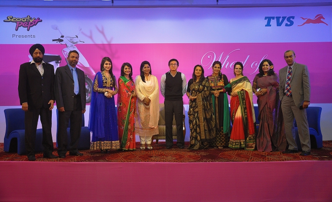 Participants of a seminar styled “Wheel of Women's Success” pose at Bangabandhu International Conference Centre in Dhaka on Saturday. Scooty Pep+ brand of TVS Auto organised the event to encourage women empowerment. Photo: TVS Auto