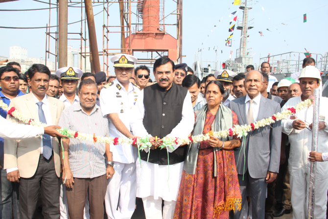 Shajahan Khan, shipping minister, cuts a ribbon to mark the handover of BNS Khanjahan Ali, an oil tanker, at Meghnaghat in Narayanganj yesterday. Ananda Shipyard built the tanker for Bangladesh Navy. Photo: Ananda Shipyard 