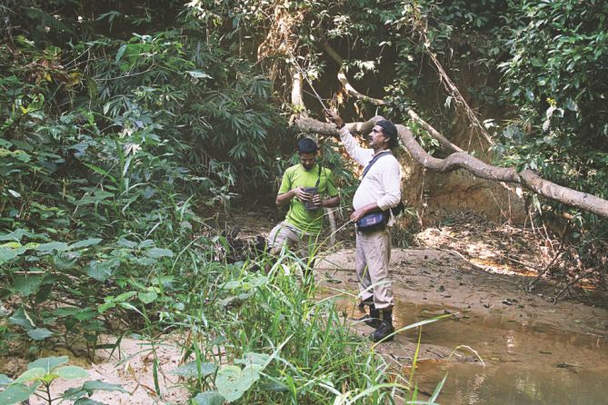 Shariar Caesar, left, and SMA Rashid, right, trying to track Chaity with telemeter . 