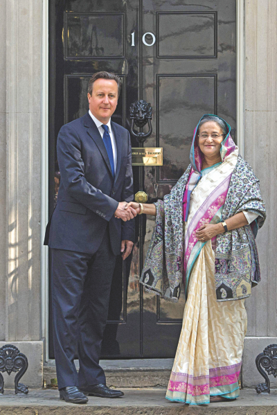 British premier David Cameron greets PM Sheikh Hasina outside 10 Downing Street in London yesterday. Photo: AFP