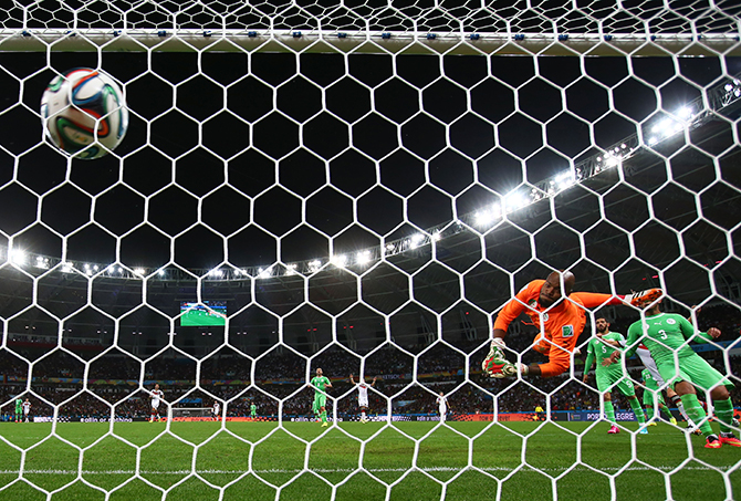 Rais M'Bolhi of Algeria fails to save a shot by Andre Schuerrle of Germany (not pictured) for Germany's first goal in extra time during the 2014 FIFA World Cup Brazil Round of 16 match between Germany and Algeria at Estadio Beira-Rio on June 30, 2014 in Porto Alegre, Brazil. Photo: Getty Images