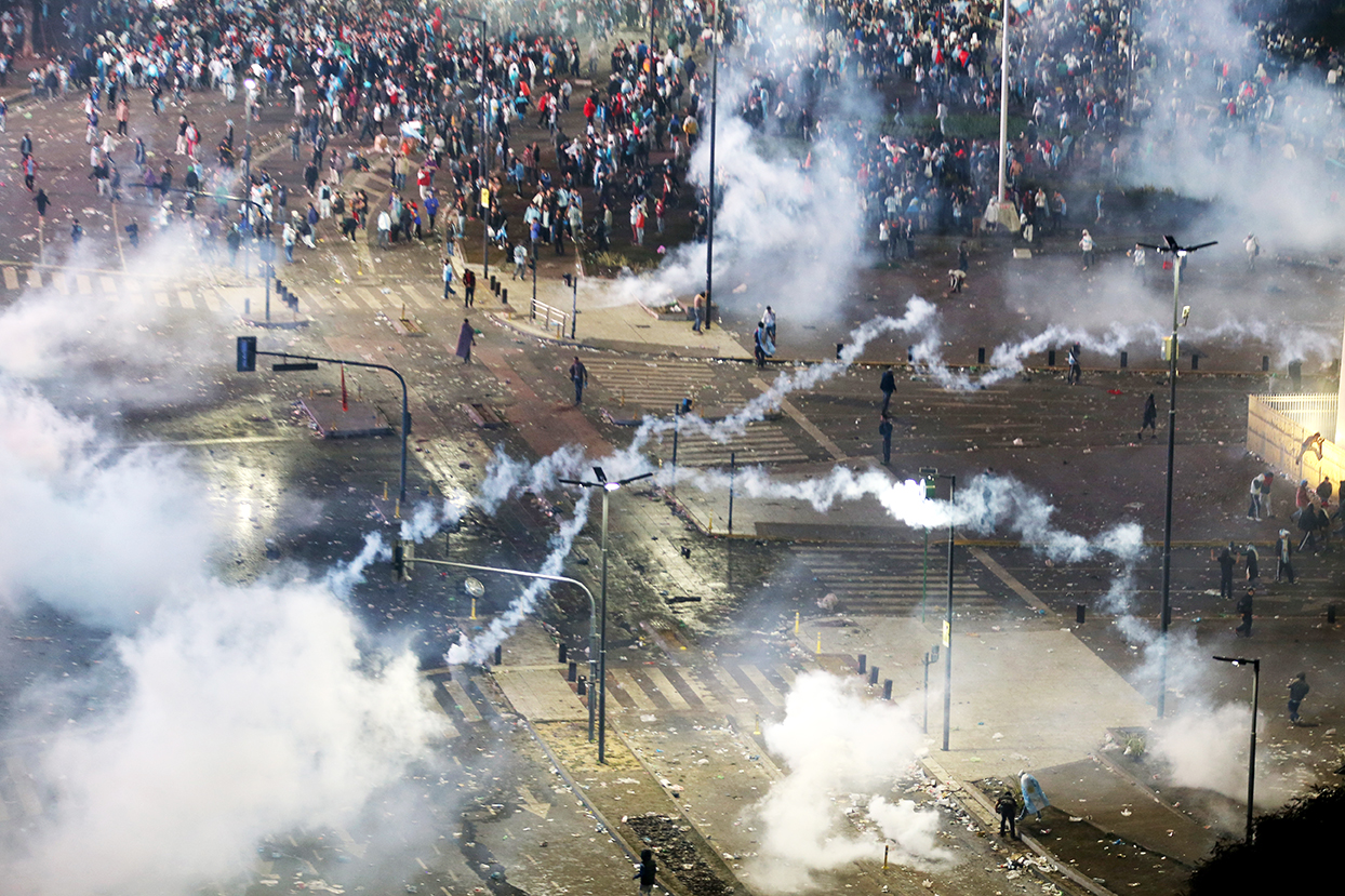 Police fire tear gas at Argentine soccer fans that turned violent near the Obelisco de Buenos Aires after their team lost to Germany 1-0 during the World Cup final on July 13, 2014 in Buenos Aires, Argentina. Photo: Getty Images