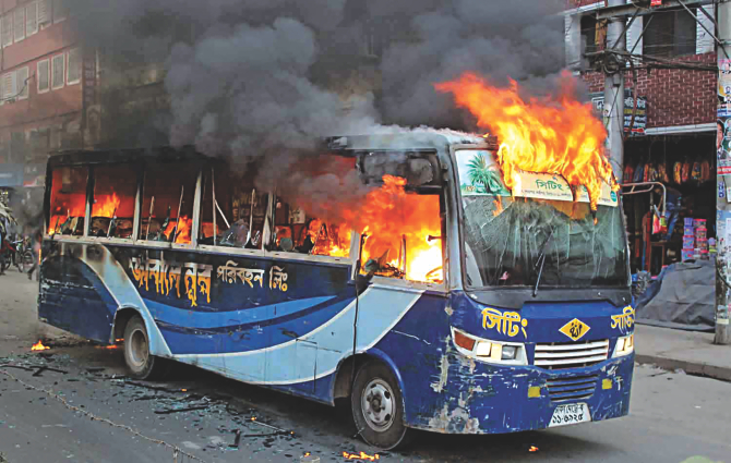 The file photo shows a bus has been torched on Rokeya Sarani at Sheorapara in Dhaka on Saturday, January 10, 2015 
