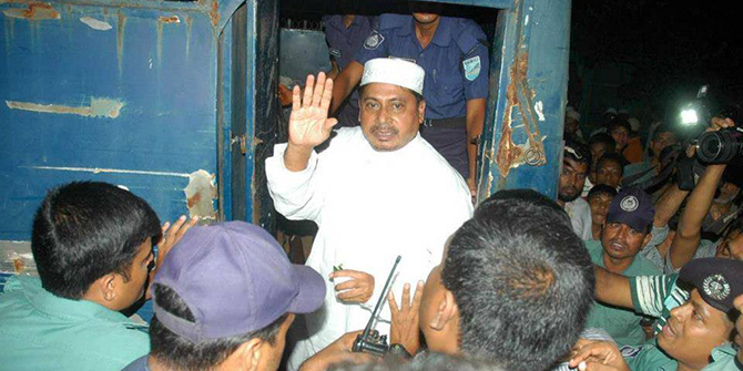 This undated photo shows law enforcers take war criminal Muhammad Kamaruzzaman to a police van in the capital. Photo taken from Facebook/ Muhammad Kamaruzzaman