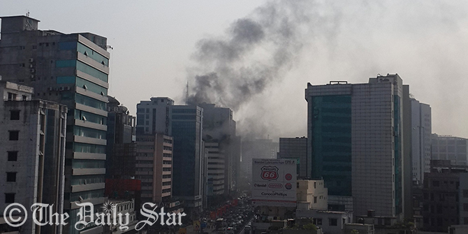 Huge smokes are gushing out from the windows of top floor of Bangladesh Steel and Engineering Corporation (BSEC) building at Kawran Bazar in Dhaka on Friday. Photo: Zaid Bin Kalam