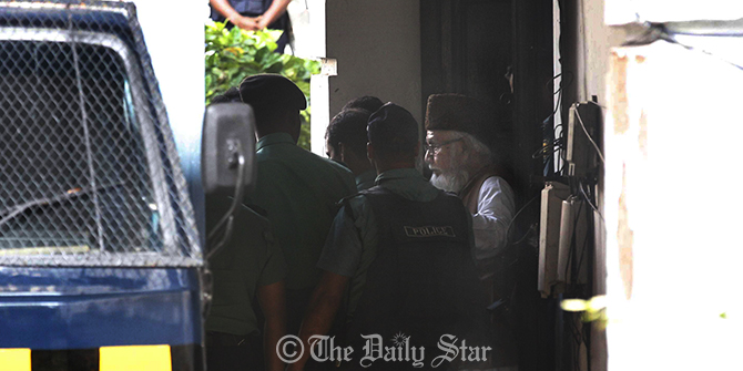 Law enforcers take war criminal Motiur Rahman Nizami to a police van after on Wednesday. A special tribunal handed death penalty to the Jamaat-e-Islami chief of four charges of war crimes, which include the killings of intellectuals at the fag end of the Liberation War in 1971. Photo: Rashed Shumon