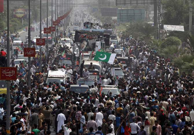 Supporters of cricketer-turned-opposition politician Imran Khan take part in the Freedom March in Gujranwala August 15, 2014. Clashes broke out Friday as tens of thousands of Pakistani protesters from two anti-government movements converged on the capital, presenting the 15-month-old civilian government with its biggest challenge yet. Photo: Reuters