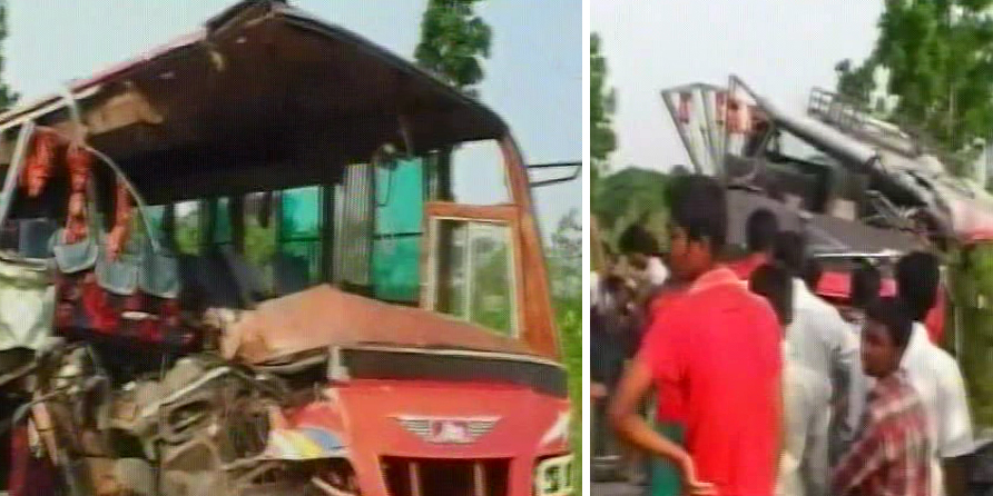 People gather near the wreckage of two busses after a head-on collision between the two killing ten people injuring dozens on the Douladia-Khulna highway in Rajbari Sadar upazila early Friday. Photo: TV grab