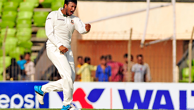 Shakib Al Hasan pumps his fist in the air after becoming the third Test cricketer -- after Ian Botham and Imran Khan -- to achieve the milestone. Star File Photo